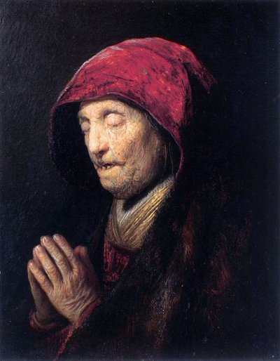 Oude vrouw die bidt door Rembrandt van Rijn
